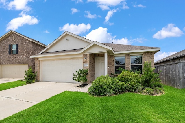 18107 Rockvine Dr, Hockley, TX 77447 - view of front of property with brick siding, driveway, and an attached garage