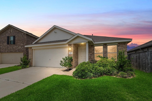 18107 Rockvine Dr, Hockley, TX 77447 - view of front of home featuring brick siding, driveway, an attached garage, and a shingled roof
