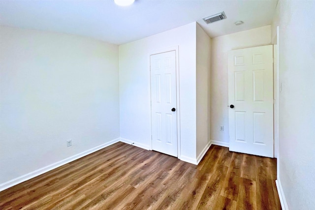 320 Azalea St, Lake Jackson, TX 77566 - unfurnished bedroom with wood finished floors, baseboards, and a closet