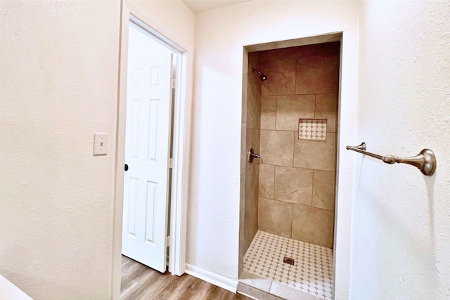 320 Azalea St, Lake Jackson, TX 77566 - bathroom featuring a stall shower and wood finished floors