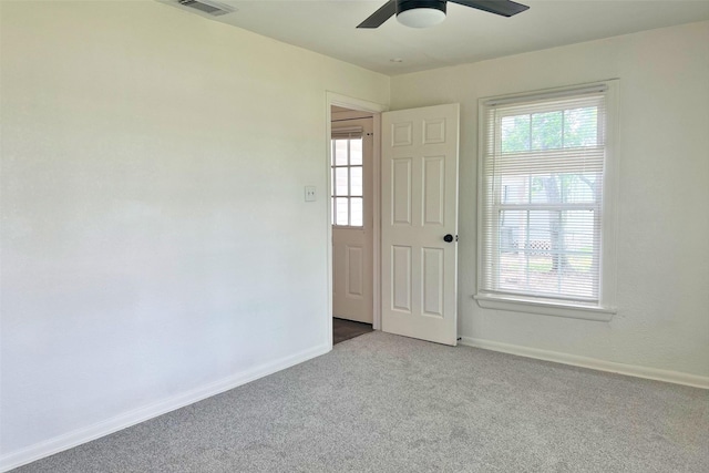 320 Azalea St, Lake Jackson, TX 77566 - spare room with carpet floors, baseboards, ceiling fan, and healthy amount of natural light
