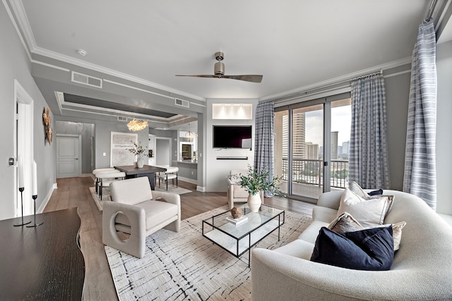 3333 Allen Pkwy Unit 1302, Houston, TX 77019 - living area with ornamental molding, baseboards, wood finished floors, and a ceiling fan