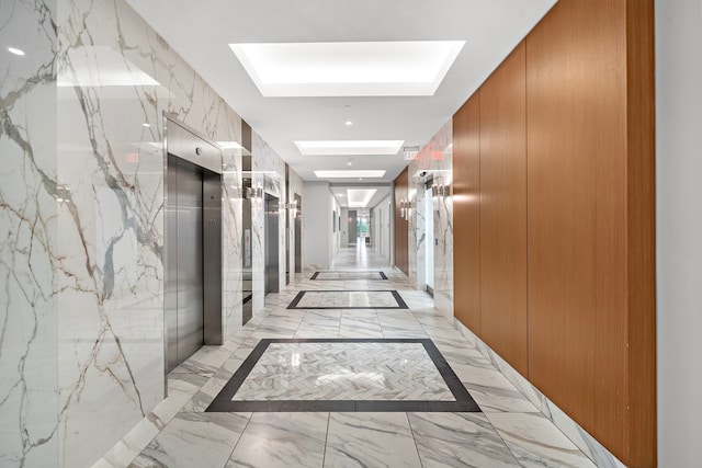 3333 Allen Pkwy Unit 1302, Houston, TX 77019 - hall with a skylight, light marble finish floors, and stone wall