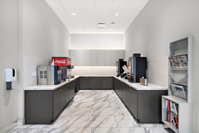 3333 Allen Pkwy Unit 1302, Houston, TX 77019 - kitchen with gray cabinets, light marble finish floors, recessed lighting, and a drop ceiling