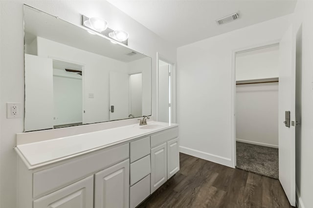 15503 Hickory Dale St, Cypress, TX 77429 - bathroom featuring wood finished floors, vanity, and baseboards