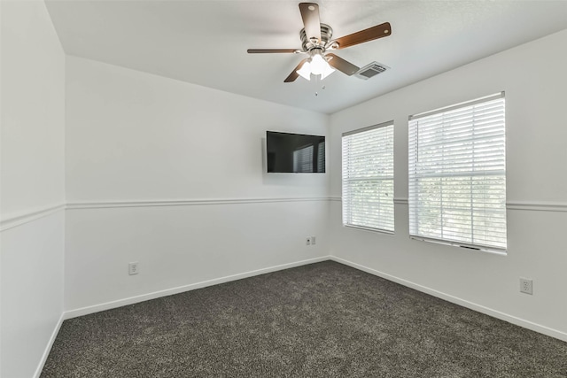 15503 Hickory Dale St, Cypress, TX 77429 - empty room featuring a ceiling fan, dark carpet, and baseboards