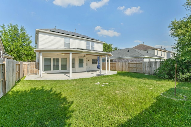 15503 Hickory Dale St, Cypress, TX 77429 - back of house featuring a ceiling fan, roof mounted solar panels, and a patio area