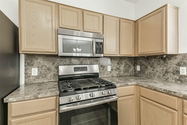 15503 Hickory Dale St, Cypress, TX 77429 - kitchen featuring appliances with stainless steel finishes, light brown cabinets, and tasteful backsplash