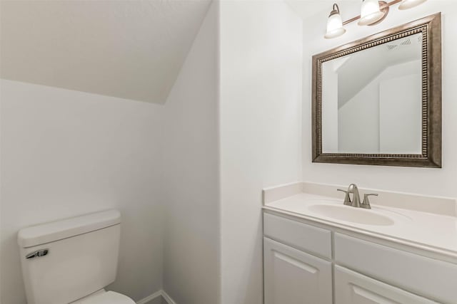 15503 Hickory Dale St, Cypress, TX 77429 - bathroom featuring toilet, vanity, and lofted ceiling