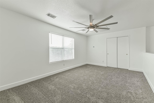 15503 Hickory Dale St, Cypress, TX 77429 - unfurnished bedroom with carpet, baseboards, a closet, ceiling fan, and a textured ceiling