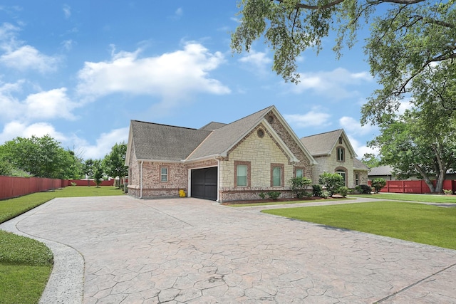 13635 Reeveston Rd, Houston, TX 77039 - view of front of house with a garage, stone siding, driveway, and roof with shingles