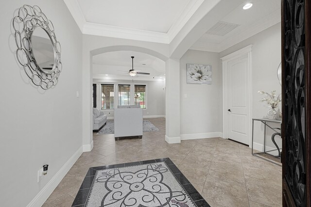 13635 Reeveston Rd, Houston, TX 77039 - entrance foyer featuring a ceiling fan, arched walkways, ornamental molding, baseboards, and recessed lighting