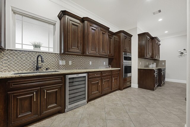 13635 Reeveston Rd, Houston, TX 77039 - kitchen with wine cooler, a sink, ornamental molding, backsplash, and dark brown cabinetry