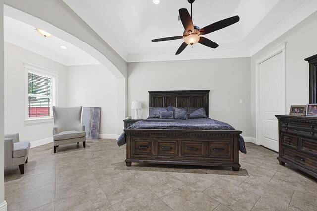 13635 Reeveston Rd, Houston, TX 77039 - bedroom with arched walkways, baseboards, ornamental molding, a raised ceiling, and ceiling fan