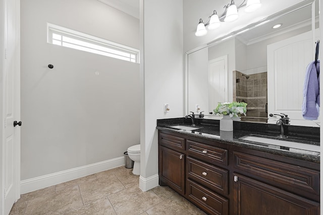 13635 Reeveston Rd, Houston, TX 77039 - full bathroom featuring double vanity, a tile shower, toilet, and baseboards