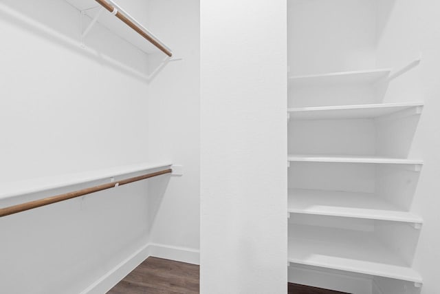 406 Wilcrest Dr Unit 406, Houston, TX 77042 - spacious closet featuring dark wood-type flooring
