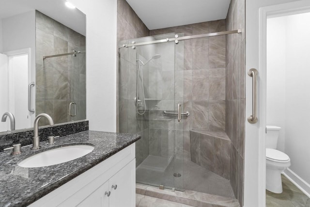 406 Wilcrest Dr Unit 406, Houston, TX 77042 - full bathroom with vanity, toilet, and a stall shower