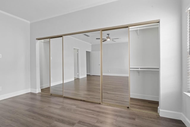 406 Wilcrest Dr Unit 406, Houston, TX 77042 - unfurnished bedroom with ornamental molding, wood finished floors, and baseboards