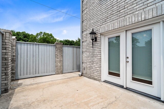 406 Wilcrest Dr Unit 406, Houston, TX 77042 - view of patio featuring french doors