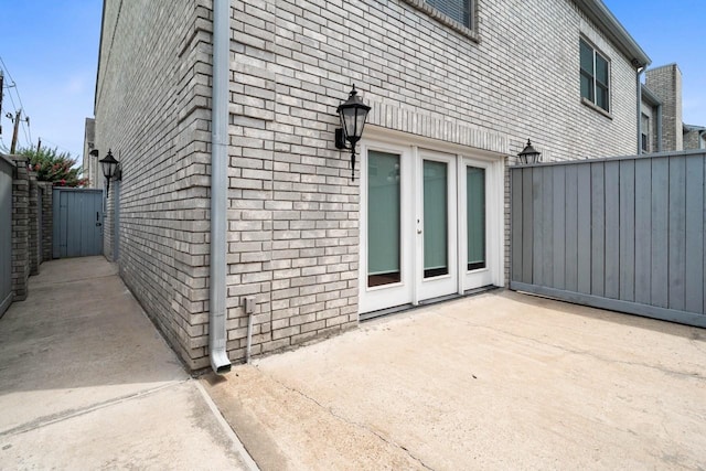 406 Wilcrest Dr Unit 406, Houston, TX 77042 - view of side of home with brick siding and a patio