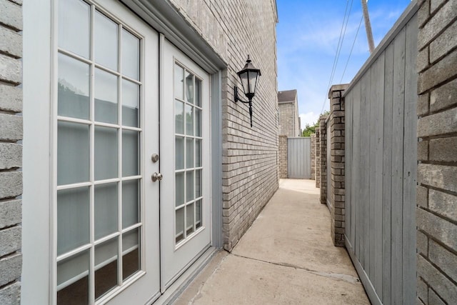 406 Wilcrest Dr Unit 406, Houston, TX 77042 - view of home's exterior featuring french doors and brick siding