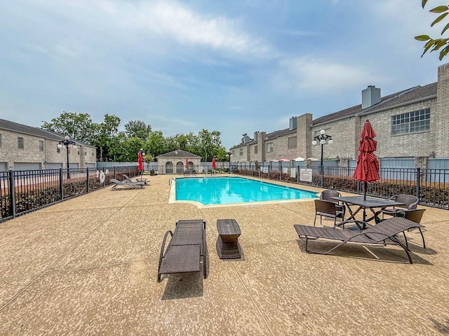 406 Wilcrest Dr Unit 406, Houston, TX 77042 - community pool featuring a patio area