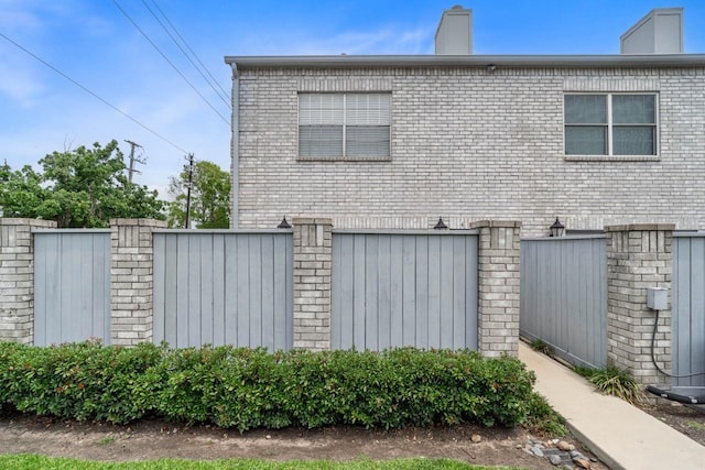 406 Wilcrest Dr Unit 406, Houston, TX 77042 - view of side of property featuring brick siding and a garage