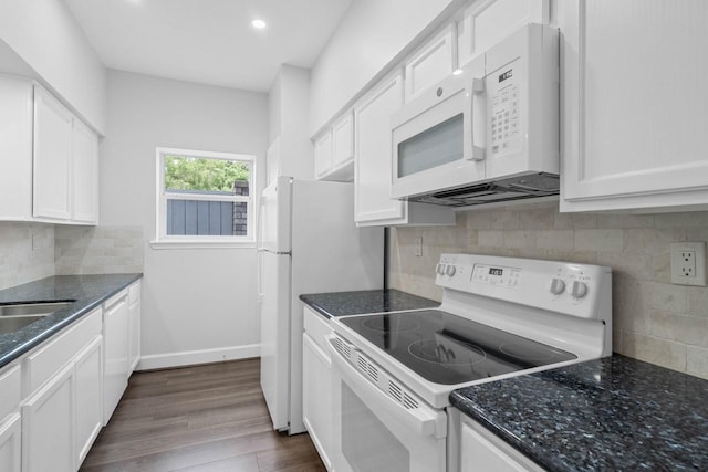 406 Wilcrest Dr Unit 406, Houston, TX 77042 - kitchen with white appliances, tasteful backsplash, white cabinetry, dark stone counters, and recessed lighting