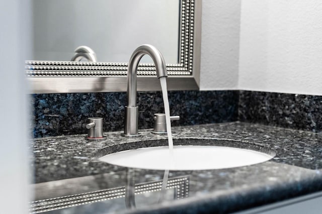406 Wilcrest Dr Unit 406, Houston, TX 77042 - bathroom view of a sink and decorative backsplash