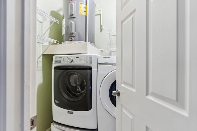 3231 Allen Pkwy Unit 4207, Houston, TX 77019 - laundry room featuring water heater and washing machine and dryer