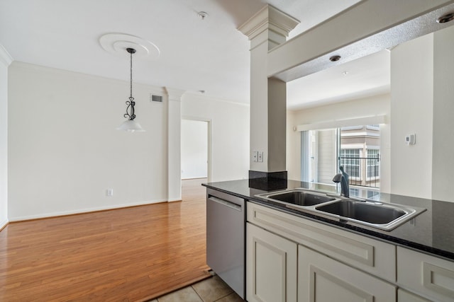 3231 Allen Pkwy Unit 4207, Houston, TX 77019 - kitchen with dishwasher, a sink, dark countertops, ornate columns, and decorative light fixtures