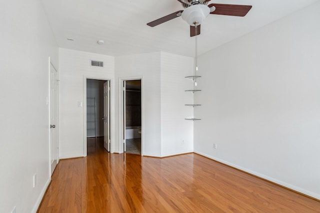 3231 Allen Pkwy Unit 4207, Houston, TX 77019 - unfurnished bedroom featuring wood finished floors, a spacious closet, and baseboards
