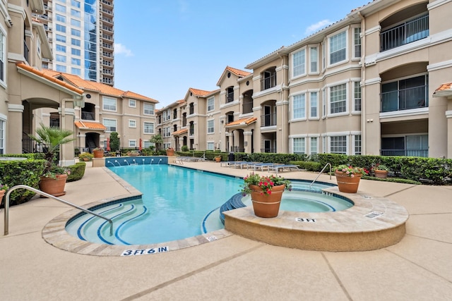 3231 Allen Pkwy Unit 4207, Houston, TX 77019 - community pool featuring a patio and a residential view