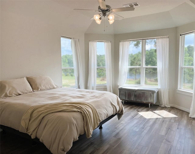11755 Oakwood Ranch Dr, Willis, TX 77378 - bedroom featuring wood finished floors, ceiling fan, and baseboards