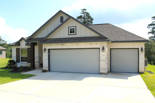 11755 Oakwood Ranch Dr, Willis, TX 77378 - view of front of house with a garage, board and batten siding, roof with shingles, and driveway
