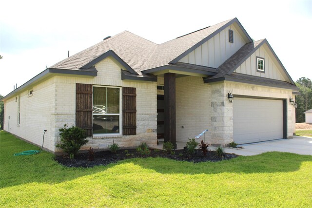 11755 Oakwood Ranch Dr, Willis, TX 77378 - view of front of home featuring board and batten siding, a shingled roof, brick siding, and a front yard