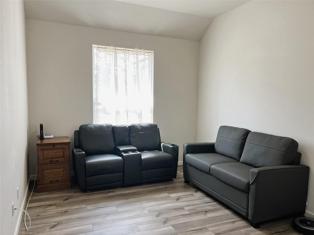 11755 Oakwood Ranch Dr, Willis, TX 77378 - living room featuring light wood finished floors and lofted ceiling