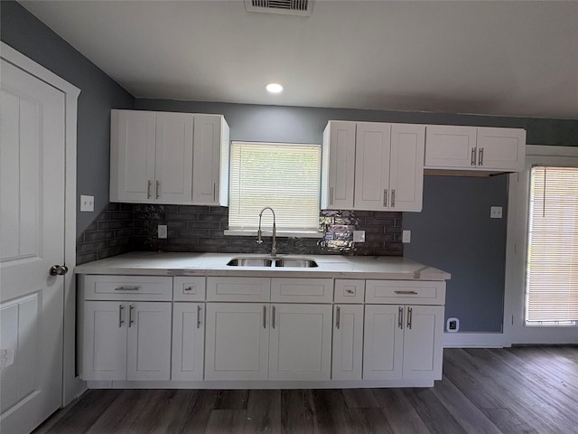5159 Dumore Dr, Houston, TX 77048 - kitchen featuring a sink, white cabinets, dark wood-style floors, and recessed lighting