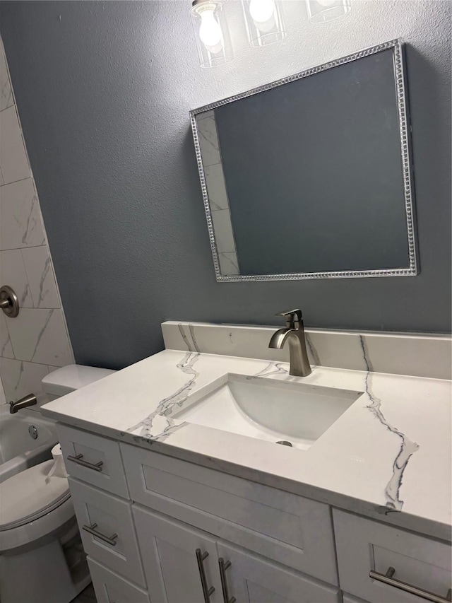 5159 Dumore Dr, Houston, TX 77048 - full bath featuring vanity, toilet, shower / bathtub combination, and a textured wall
