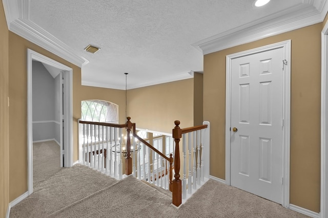 17114 Bur Oak Ct, Spring, TX 77379 - hall with crown molding, carpet, an upstairs landing, baseboards, and a textured ceiling