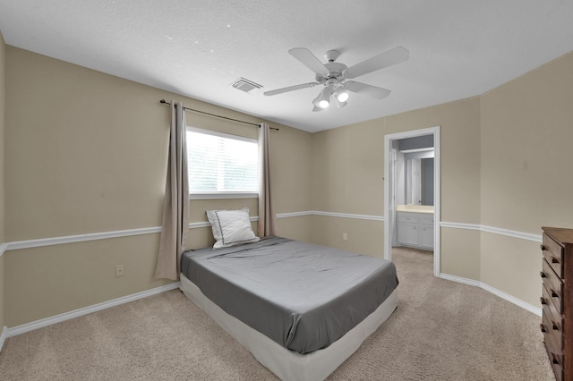 17114 Bur Oak Ct, Spring, TX 77379 - carpeted bedroom with baseboards, a ceiling fan, and ensuite bathroom