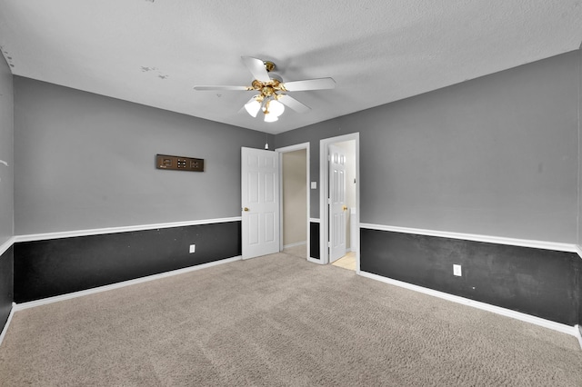 17114 Bur Oak Ct, Spring, TX 77379 - unfurnished bedroom featuring carpet flooring, a ceiling fan, baseboards, and a textured ceiling