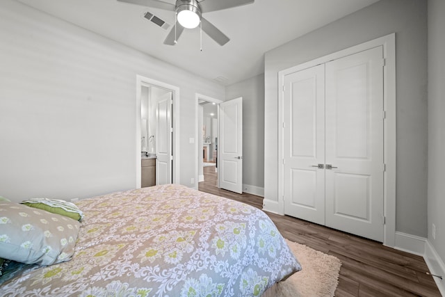 2310 Desert Holly Dr, Katy, TX 77493 - bedroom featuring wood finished floors, a closet, baseboards, and ceiling fan