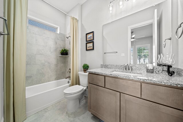 2310 Desert Holly Dr, Katy, TX 77493 - full bath featuring toilet, shower / tub combo with curtain, vanity, and a ceiling fan