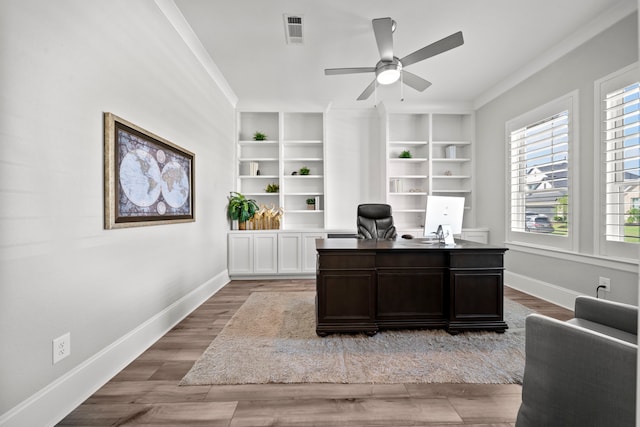 2310 Desert Holly Dr, Katy, TX 77493 - office area with a ceiling fan, baseboards, wood finished floors, and crown molding