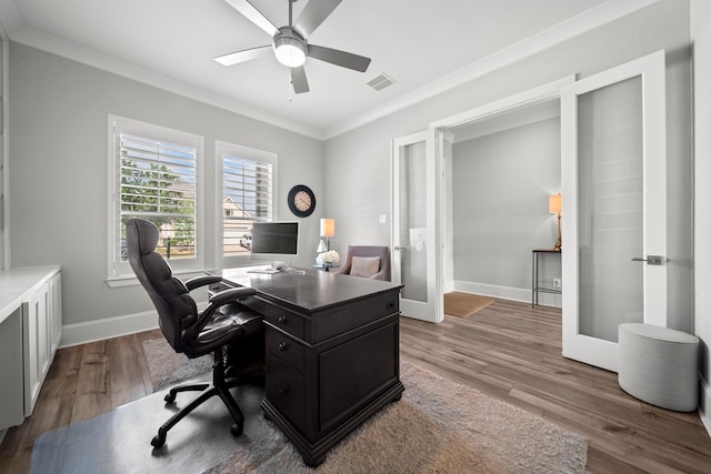 2310 Desert Holly Dr, Katy, TX 77493 - home office with crown molding, wood finished floors, a ceiling fan, baseboards, and french doors