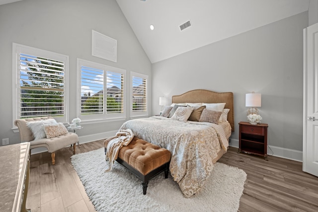 2310 Desert Holly Dr, Katy, TX 77493 - bedroom featuring high vaulted ceiling, wood finished floors, and baseboards