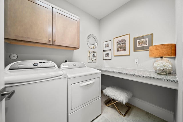 2310 Desert Holly Dr, Katy, TX 77493 - laundry area with cabinet space and separate washer and dryer