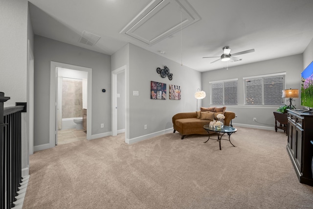 2310 Desert Holly Dr, Katy, TX 77493 - living area with attic access, light colored carpet, a ceiling fan, and baseboards