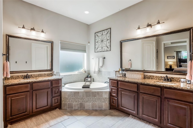 10040 Easton Sky Ln, Cypress, TX 77433 - ensuite bathroom featuring tile patterned floors, a garden tub, and two vanities